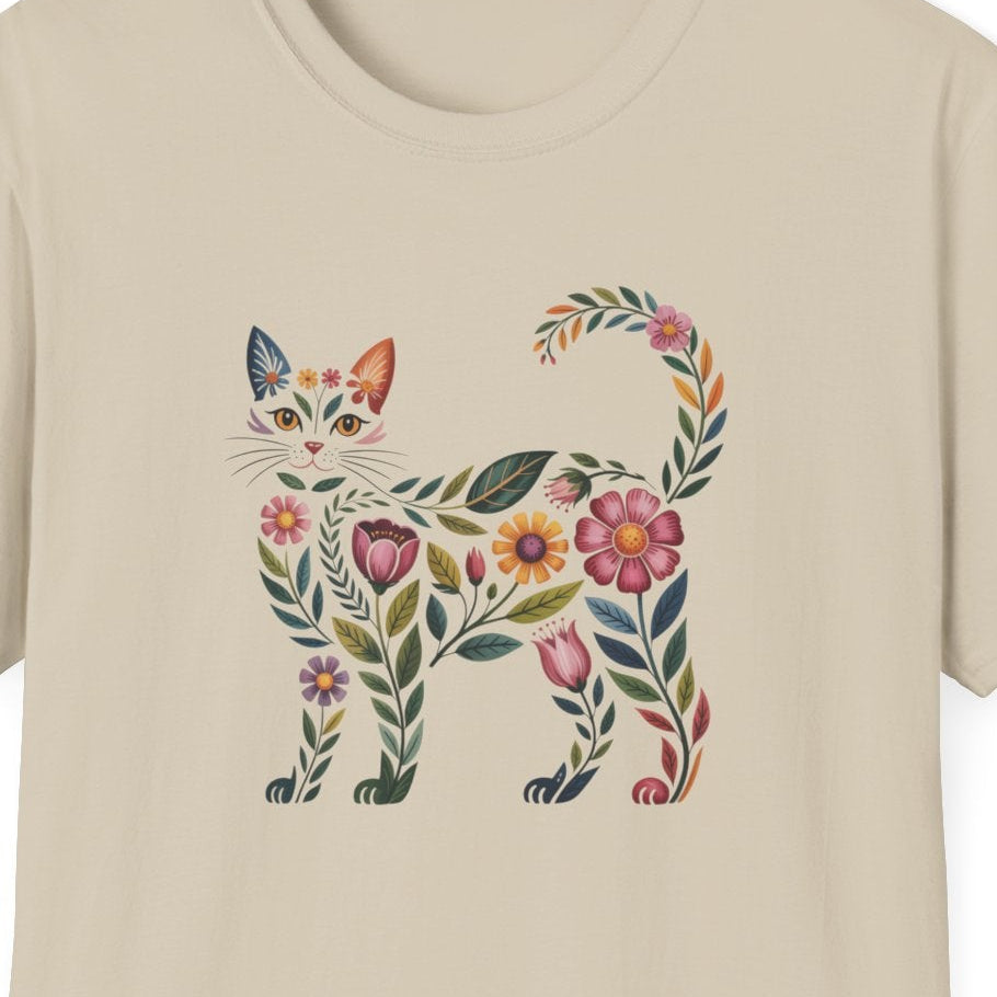Beige t-shirt with a colorful cat design on a white background
